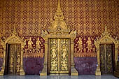 Luang Prabang, Laos - Wat Sene, the sim, The main door is decorated with a gilded stupa among stencilled gilded apsaras. 